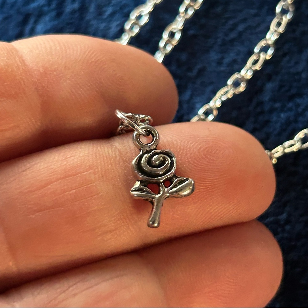 Silver rose pendant on chain necklace